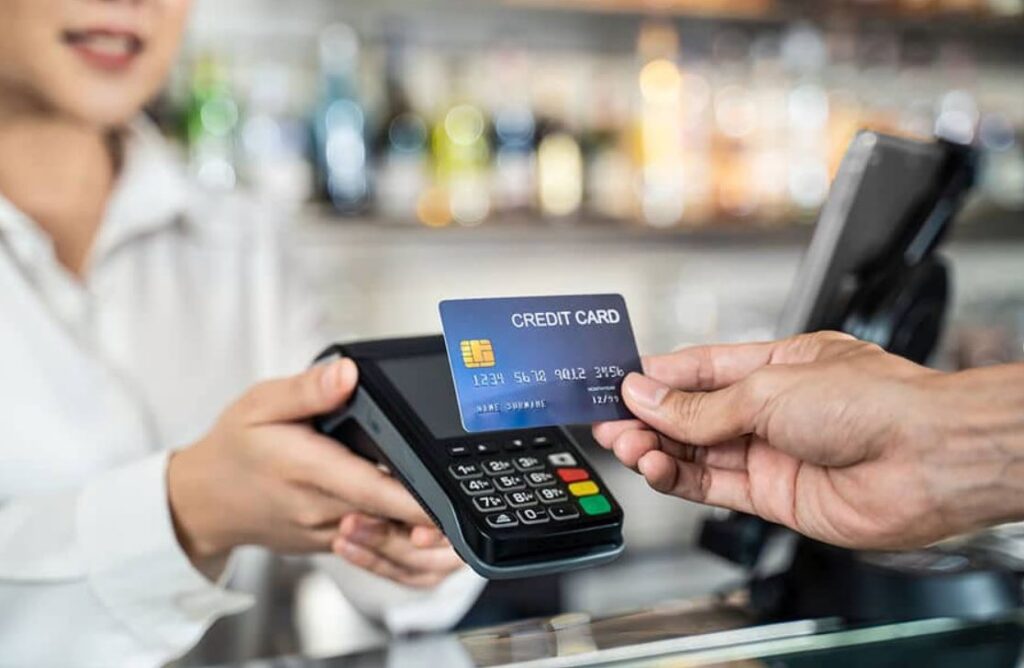 a man paying via credit card