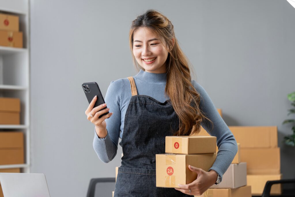 an online business owner checking her phone