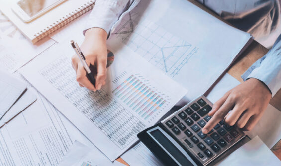 a professional calculating his expenses