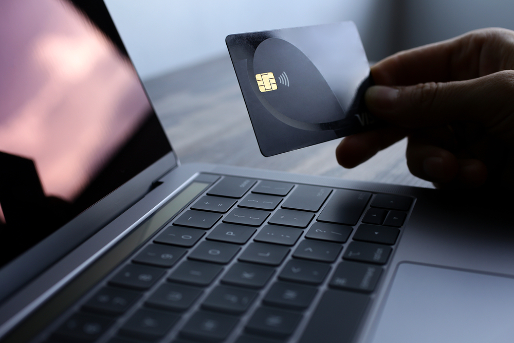 credit card beside the laptop