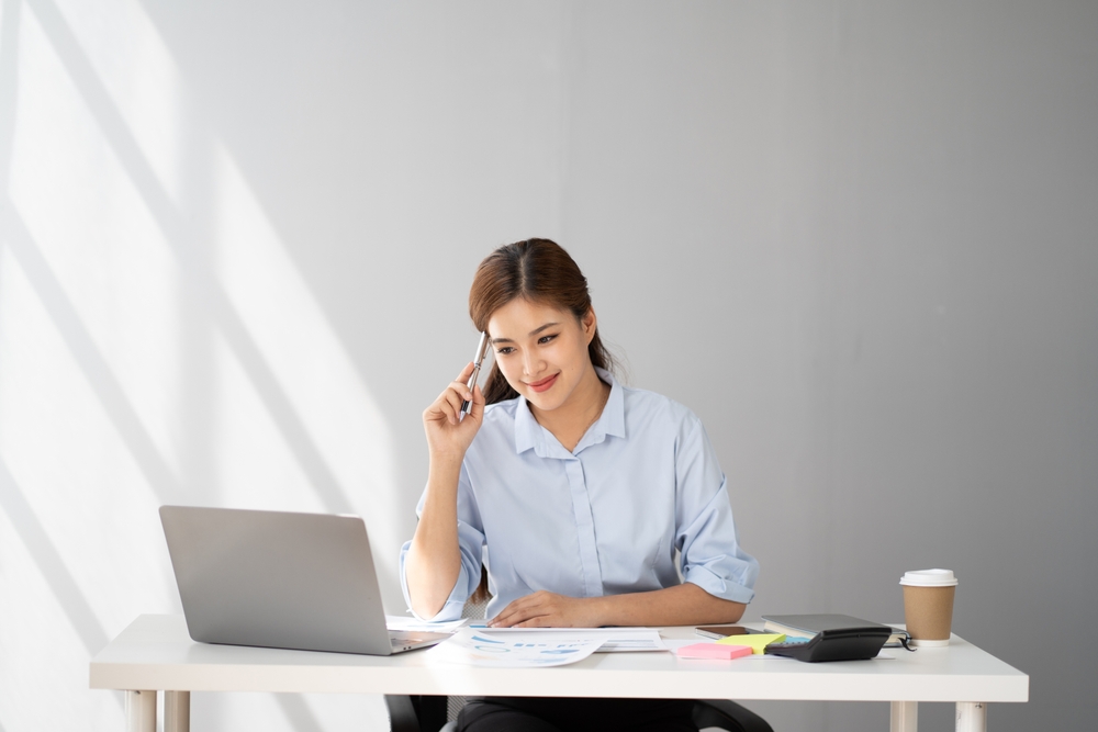 a young woman tracking her expenses
