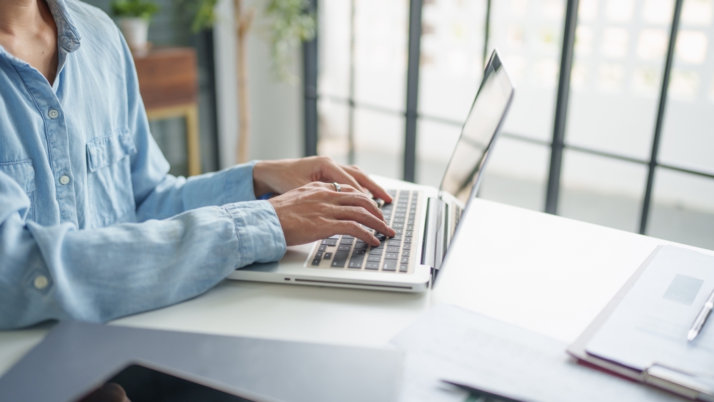 a professional using his laptop