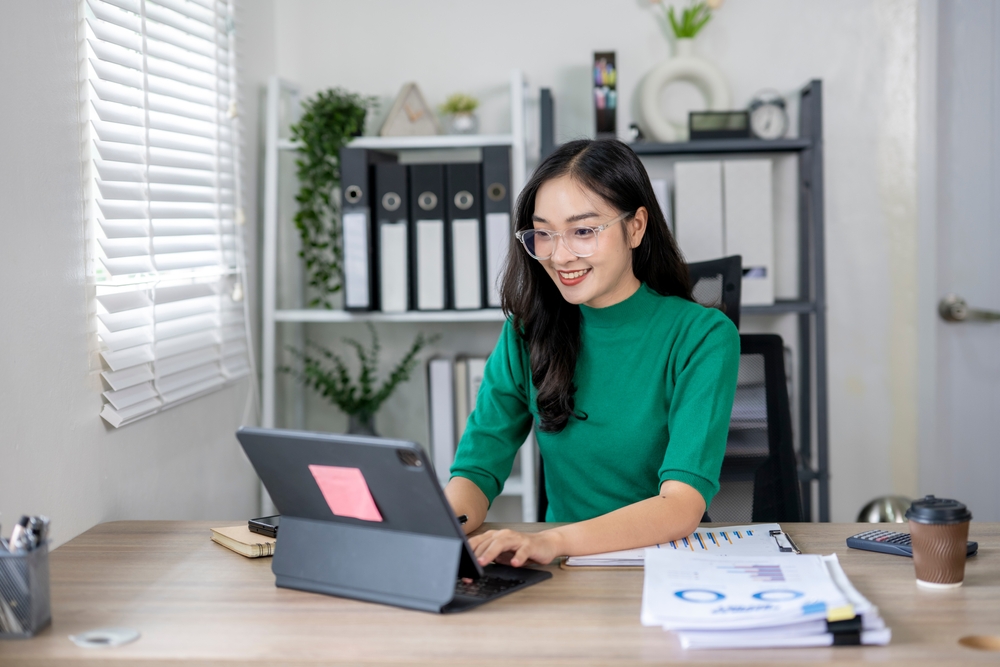 a woman creating her diy expense sheet