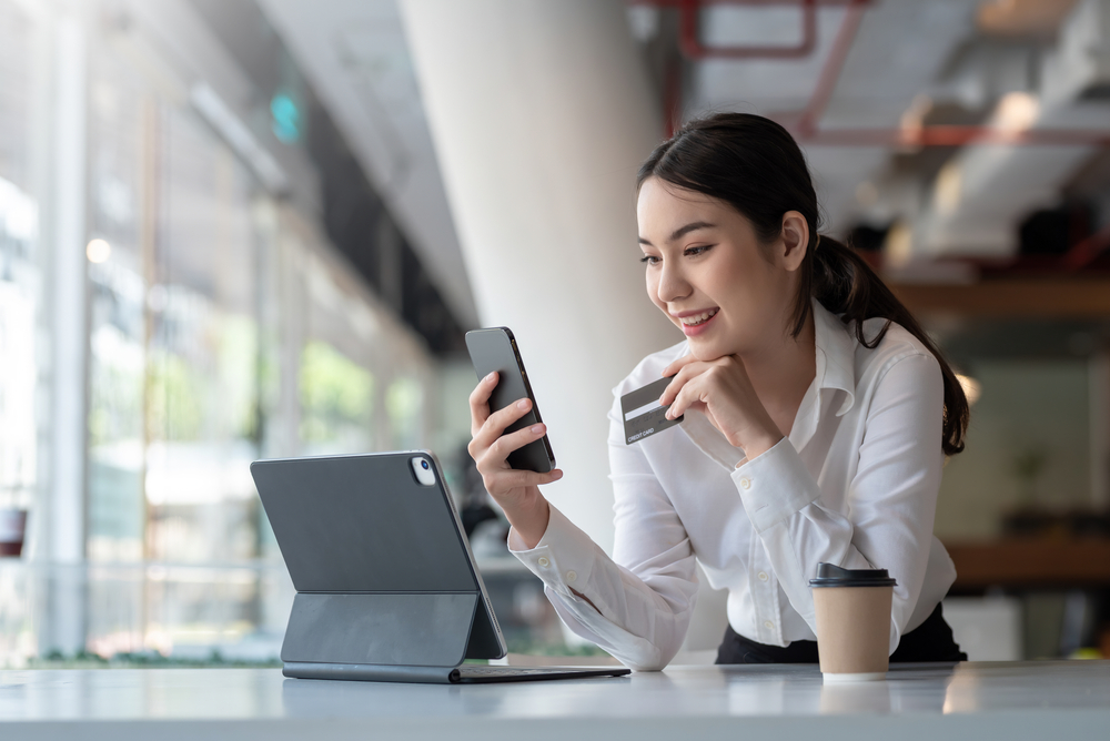 a woman using a credit card